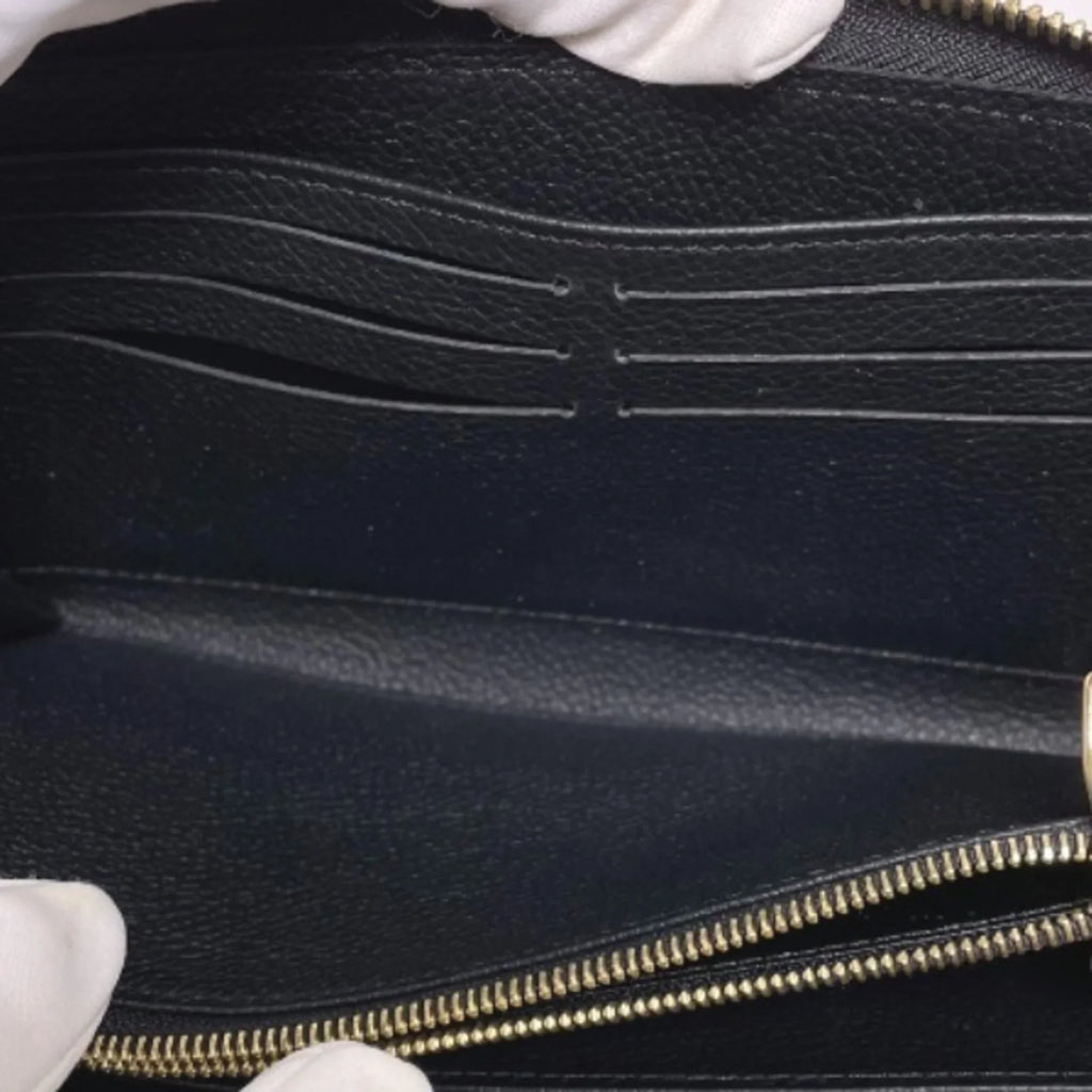 Pre-Owned LOUIS VUITTON Round Zipper Monogram Empreinte Zippy Wallet M61864 Louis Vuitton Noir Long LV (Good)